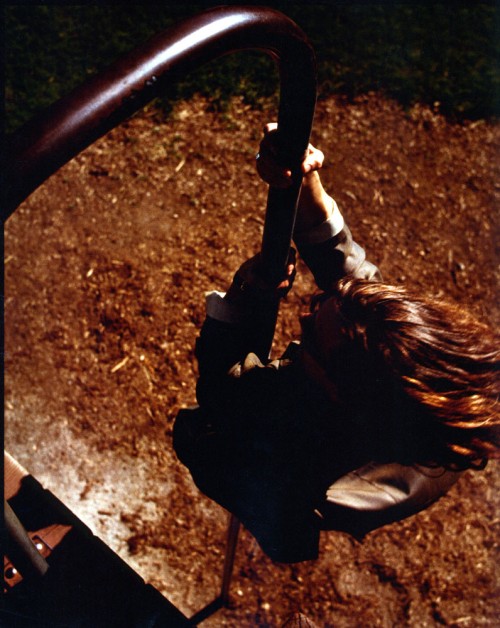 Robert Smith on kiddie slide